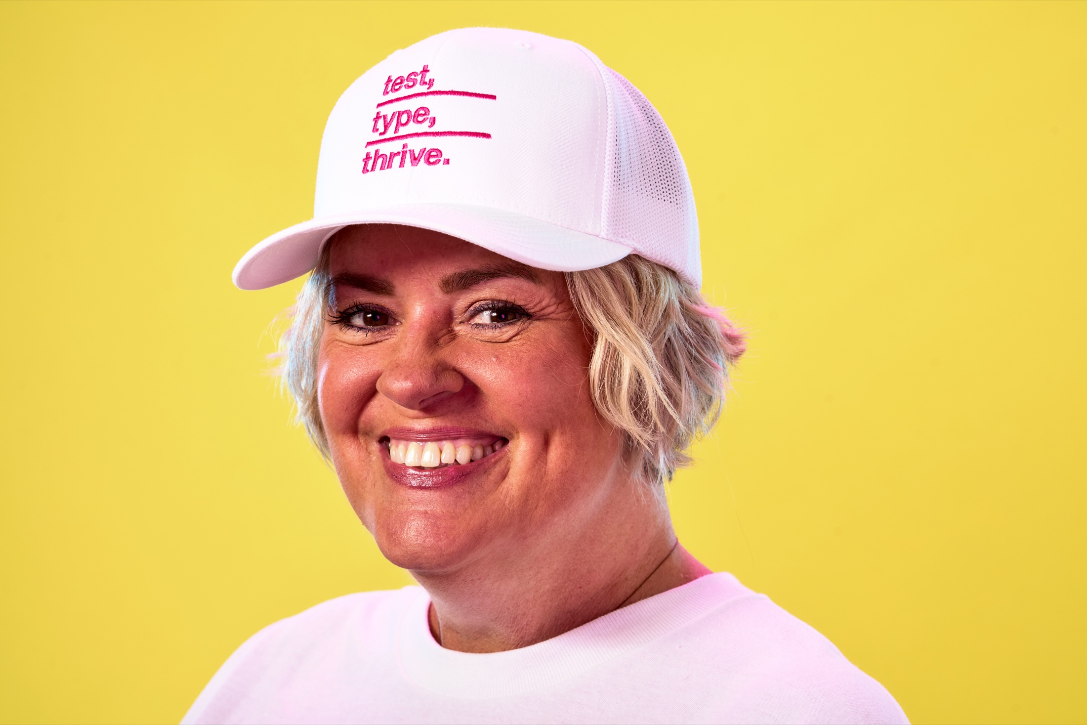 A woman wearing a Type Hype cap